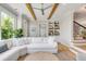Inviting living room with wooden ceiling beams, a comfortable sectional couch, and access to the staircase at 2 Piedmont Ave # A, Charleston, SC 29403