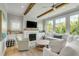 Comfortable living room showcases built-in shelves, a fireplace, and a large sectional couch perfect for relaxation at 2 Piedmont Ave # A, Charleston, SC 29403