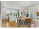 Open living space with a dining area, kitchen, and lots of natural light at 2 Piedmont Ave # A, Charleston, SC 29403
