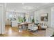 Open-concept living space with dining area, bright kitchen, and lots of natural light at 2 Piedmont Ave # A, Charleston, SC 29403