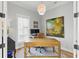 Bright office space with modern light fixture, large window and colorful artwork. Ideal for work from home at 2 Piedmont Ave # A, Charleston, SC 29403