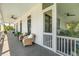 Charming porch with wicker chairs and ceiling fans, perfect for enjoying the outdoors at 2 Piedmont Ave # A, Charleston, SC 29403