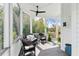 Inviting screened porch with comfortable wicker furniture and a view of the serene outdoors at 2 Piedmont Ave # A, Charleston, SC 29403