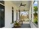 Charming porch with wicker seating and ceiling fans, ideal for relaxing and enjoying the view at 2 Piedmont Ave # A, Charleston, SC 29403