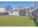 Well-maintained backyard featuring a screened-in porch and lush green lawn at 215 Shortmarsh St, Summerville, SC 29486