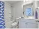 The full bathroom features a shower with a tub, a single sink vanity, and a blue whale-themed shower curtain at 215 Shortmarsh St, Summerville, SC 29486