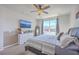 Comfortable bedroom has ceiling fan, large window, and wood-look accent wall at 215 Shortmarsh St, Summerville, SC 29486