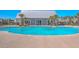 Spacious community pool with a large building for changing and relaxing with palm trees at 215 Shortmarsh St, Summerville, SC 29486