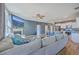 Open-concept living space featuring a fireplace, large TV, and kitchen with island seating at 215 Shortmarsh St, Summerville, SC 29486