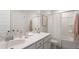 Clean bathroom featuring white cabinets, ample counter space, and a shower with a tub and shower curtain at 216 Yalton St, Summerville, SC 29486