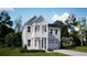 Charming two-story home with a light-green exterior, white trim, and well-manicured front lawn at 216 Yalton St, Summerville, SC 29486