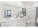 Bright bathroom with dual sink vanity, a large mirror, and a bathtub with shower at 220 Callibluff Dr, Summerville, SC 29486