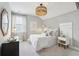 Cozy bedroom with neutral decor, modern lighting, and carpet flooring at 220 Callibluff Dr, Summerville, SC 29486