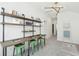 Bonus room featuring unique desk with metal supports and shelving, bathed in bright, natural light at 220 Callibluff Dr, Summerville, SC 29486