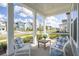 Inviting front porch with seating, perfect for relaxing and enjoying the neighborhood view at 220 Callibluff Dr, Summerville, SC 29486