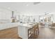 Bright, open kitchen with a large island, white cabinetry, stainless steel appliances, and hardwood floors at 220 Callibluff Dr, Summerville, SC 29486