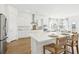 Bright open kitchen with white cabinets, an island with seating, and stainless steel appliances at 220 Callibluff Dr, Summerville, SC 29486