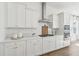 Well-lit kitchen showcasing white cabinets, subway tile backsplash, and stainless steel appliances at 220 Callibluff Dr, Summerville, SC 29486