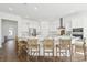 Spacious kitchen with white cabinets, stainless steel appliances, and a large center island with seating at 220 Callibluff Dr, Summerville, SC 29486