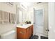 Bathroom with wood vanity, soft lighting, and neutral wall paint at 224 Jackson St, Goose Creek, SC 29445