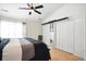 Bedroom with large sliding closet, and large window at 224 Jackson St, Goose Creek, SC 29445