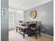 Bright dining area showcasing a contemporary table, unique wall decor and neutral paint at 224 Jackson St, Goose Creek, SC 29445