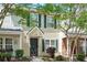 Charming two-story townhome with traditional architecture, green shutters and a well maintained lawn at 224 Jackson St, Goose Creek, SC 29445
