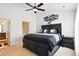 Primary bedroom with dark furniture, carpet flooring, and a ceiling fan at 224 Jackson St, Goose Creek, SC 29445