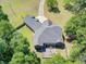 Aerial view of home with patio, backyard firepit, and lush tree perimeter for private entertainment at 225 Ridge Rd, Ridgeville, SC 29472