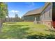 Spacious backyard featuring a trampoline, fenced yard, and well-maintained lawn, perfect for outdoor activities at 225 Ridge Rd, Ridgeville, SC 29472