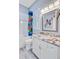 Bright bathroom featuring a tub with playful superhero-themed shower curtain and a granite vanity at 225 Ridge Rd, Ridgeville, SC 29472