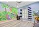 Whimsical bedroom with a jungle-themed mural, perfect for a room or playroom at 225 Ridge Rd, Ridgeville, SC 29472