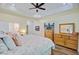Spacious bedroom features a TV, dresser, and walk in closet at 225 Ridge Rd, Ridgeville, SC 29472