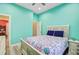 Inviting bedroom with a queen bed, light blue walls, and wood-look flooring at 225 Ridge Rd, Ridgeville, SC 29472