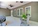 Relaxing covered patio with seating and a view of the backyard at 225 Ridge Rd, Ridgeville, SC 29472