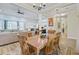 Open concept layout showcasing a spacious dining area adjacent to the living room and kitchen at 225 Ridge Rd, Ridgeville, SC 29472