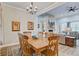 Inviting dining room and open living space featuring a stone fireplace and elegant furnishings at 225 Ridge Rd, Ridgeville, SC 29472