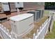 Exterior home generator with HVAC units behind a white picket fence at 225 Ridge Rd, Ridgeville, SC 29472