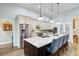 Modern kitchen with granite countertops, stainless appliances, and a spacious island with bar seating at 225 Ridge Rd, Ridgeville, SC 29472