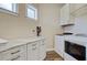 Functional laundry room featuring a folding table and front-loading washer and dryer at 225 Ridge Rd, Ridgeville, SC 29472