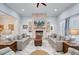 Comfortable living room with stone fireplace feature, built in shelves, and bright lighting at 225 Ridge Rd, Ridgeville, SC 29472