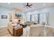 Cozy living room features a stone fireplace, built-in shelving, and comfortable, neutral furnishings at 225 Ridge Rd, Ridgeville, SC 29472