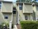 Inviting townhouse with unique architecture, light green siding, and well-maintained landscaping at 2314 Treescape Dr # 2406, Charleston, SC 29414