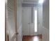 Hallway featuring clean white trim, and a view to a door with natural light at 2314 Treescape Dr # 2406, Charleston, SC 29414