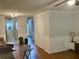 Open living room with wood floors, white wainscoting, and a view to the kitchen at 2314 Treescape Dr # 2406, Charleston, SC 29414