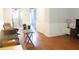 Bright living room featuring hardwood floors, white trim, and an open layout to the kitchen at 2314 Treescape Dr # 2406, Charleston, SC 29414