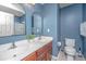 Bathroom features a double sink vanity with a large arched mirror and a separate walk-in shower at 247 Darcy Ave, Goose Creek, SC 29445