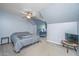 Bedroom featuring a cozy bed, ceiling fan, a workspace, and a tv for a comfortable retreat at 247 Darcy Ave, Goose Creek, SC 29445