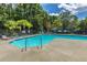 Large community pool with clear blue water, surrounded by comfortable lounge chairs for sunny relaxation at 247 Darcy Ave, Goose Creek, SC 29445