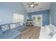 Bright living room with vaulted ceiling, a ceiling fan, and French doors leading to a porch at 247 Darcy Ave, Goose Creek, SC 29445